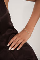 Gold 925 sterling silver bracelet with dangling and teardrop-shaped crystal stone details 119