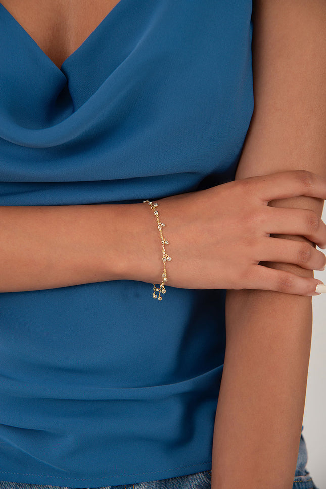 Gold 925 sterling silver bracelet with dangling and teardrop-shaped crystal stone details 120
