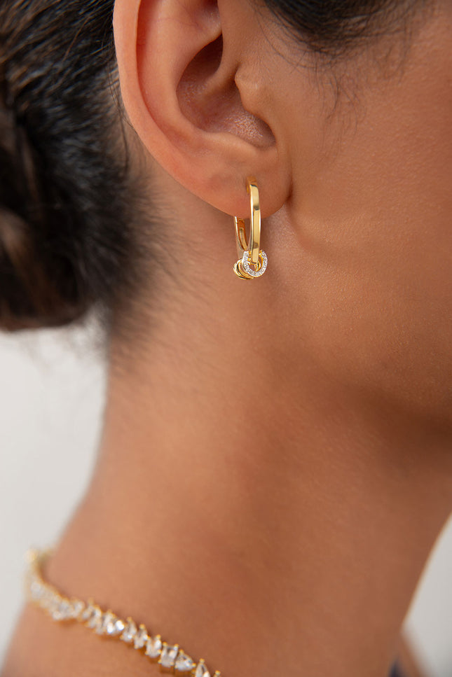 Gold 925 sterling silver earring with an elegant hoop shape and crystal stone detail at the tip 128