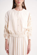Ecru Short jacket with gathered sleeves and elasticated waist with snap fasteners 61185
