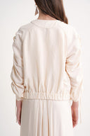 Ecru Short jacket with gathered sleeves and elasticated waist with snap fasteners 61185