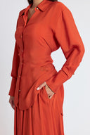 Orange Two-piece set featuring a balloon skirt and a long shirt with tie details 12399